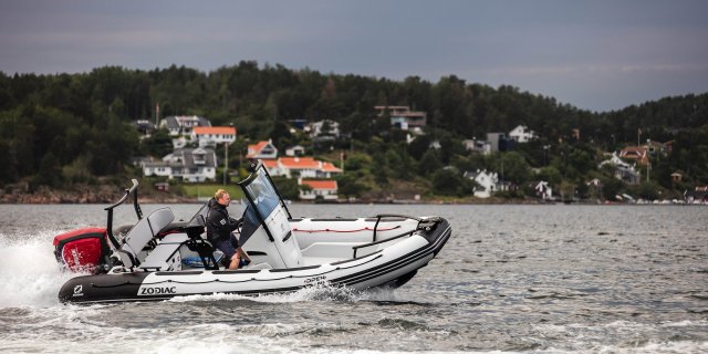 a man rips on the water in a zodiac open 6.5 from Gordon Bay Marine