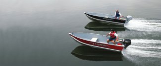two aluminum Lund WT fishing boats skimming along muskoka Ontario lake water.